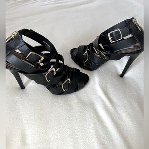 Steve Madden “Sola” Black Strappy Stilettos with Gold Buckle accents, size 9.